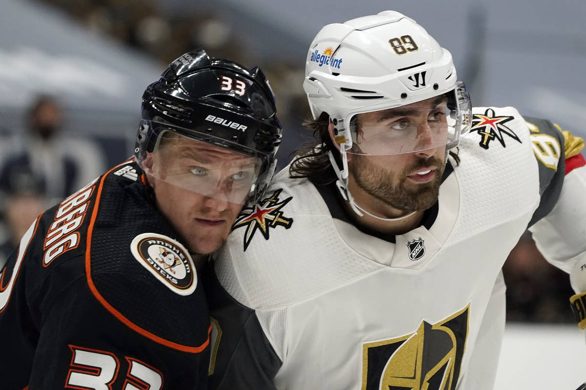 Vegas Golden Knights right wing Alex Tuch, right, is defended by Anaheim Ducks right wing Jakob ...