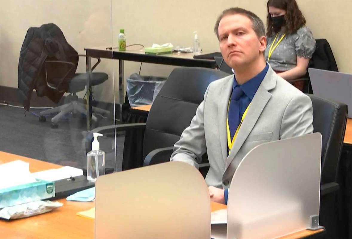 In this image from video, former Minneapolis police Officer Derek Chauvin listens as his defens ...