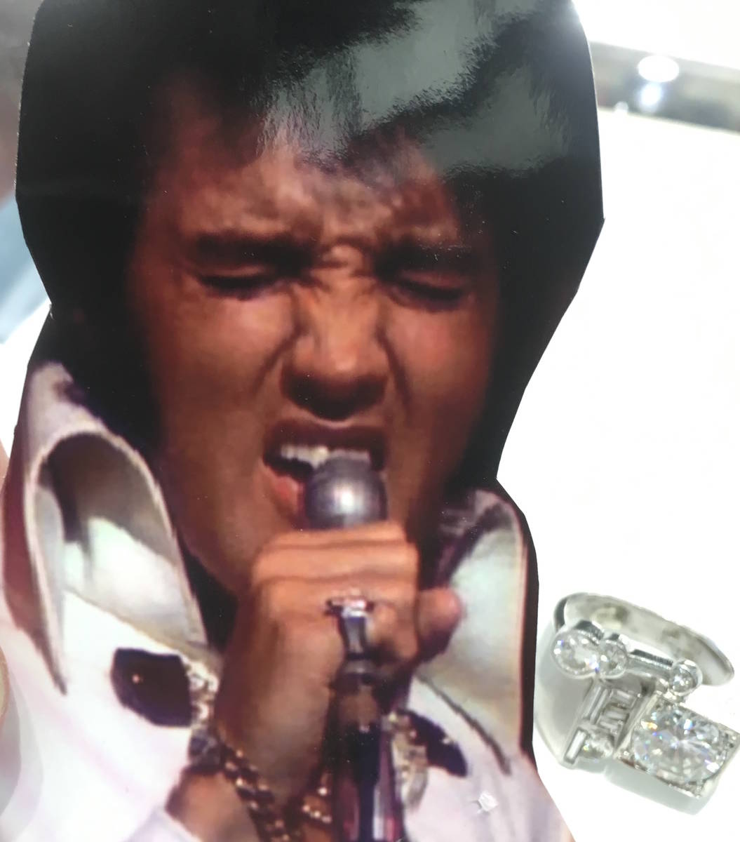 An image of Elvis Presley performing with his stage ring at Las Vegas Hilton in the 1970s. The ...