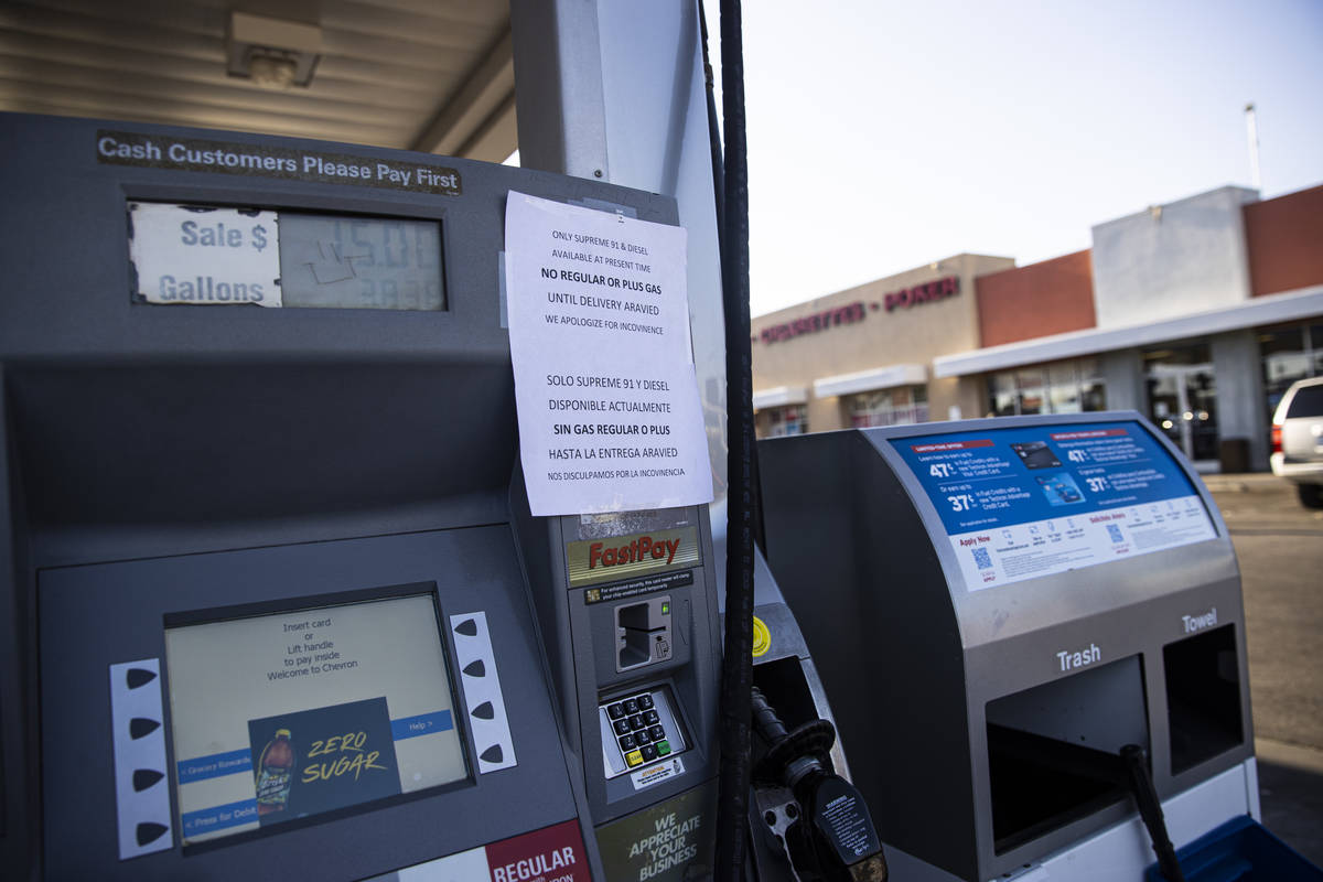 A sign stating that only supreme 91 and diesel gas is available is seen posted at a Chevron gas ...