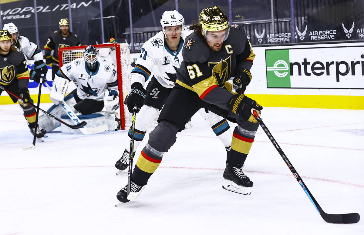 Golden Knights' Mark Stone (61) skates with the puck in front of San Jose Sharks' Nikolai Knyzh ...