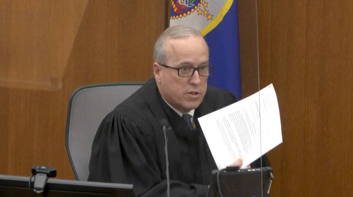 In this image from video, Hennepin County Judge Peter Cahill reads instructions to the jur ...