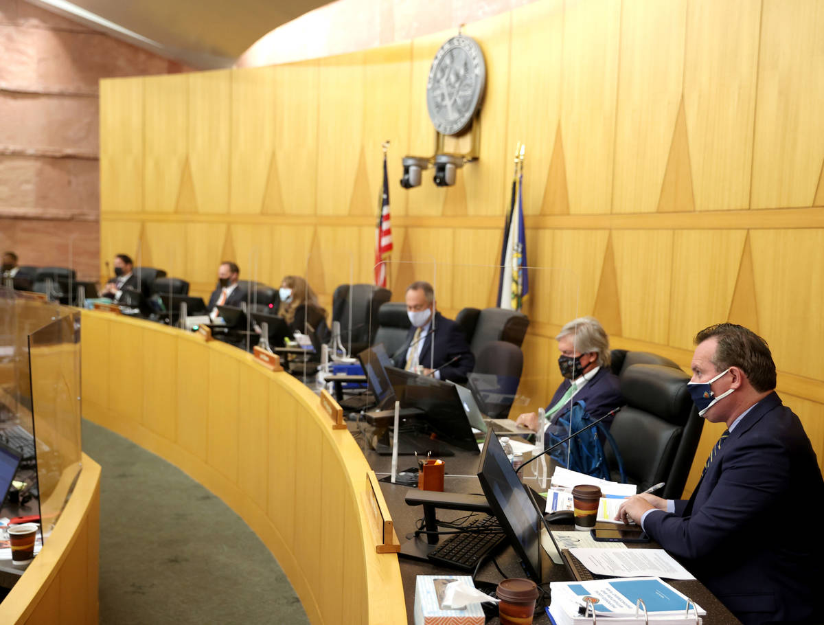 Clark County commissioners, including Ross Miller, right, during a commission meeting in Las Ve ...