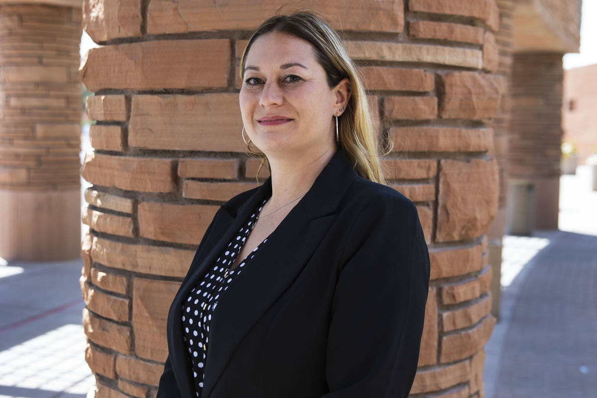 Melanie Rouse poses for a photo outside of the Clark County Government Center building after be ...