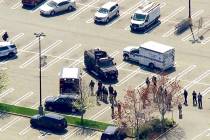 This aerial photo provided by WABC shows police responding to the scene of a shooting at a Stop ...