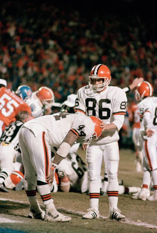 Cleveland running back Earnest Byner (44) is comforted by teammate Brian Brennan (86) after Byn ...