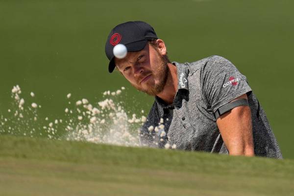 Danny Willett, of England, hits from the bunker on the seventh hole during a practice round for ...