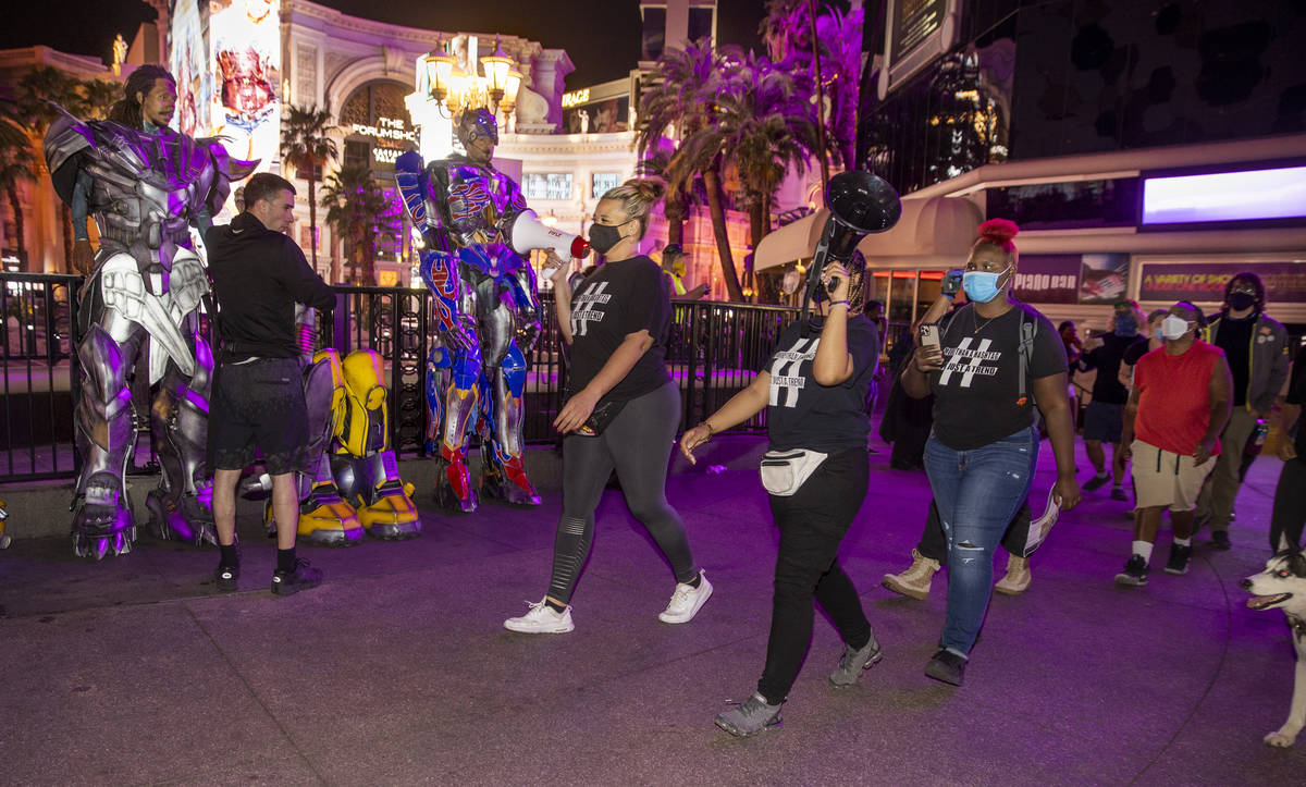 Organizers Leinati Hackley, left and Desiree Smith lead a small group march along the Strip fol ...
