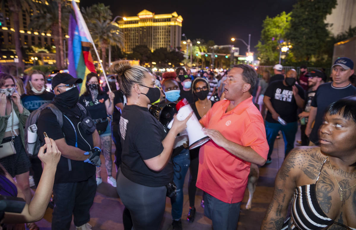 Organizer Leinati Hackley, left gets into a minor altercation with a visitor along the Strip fo ...