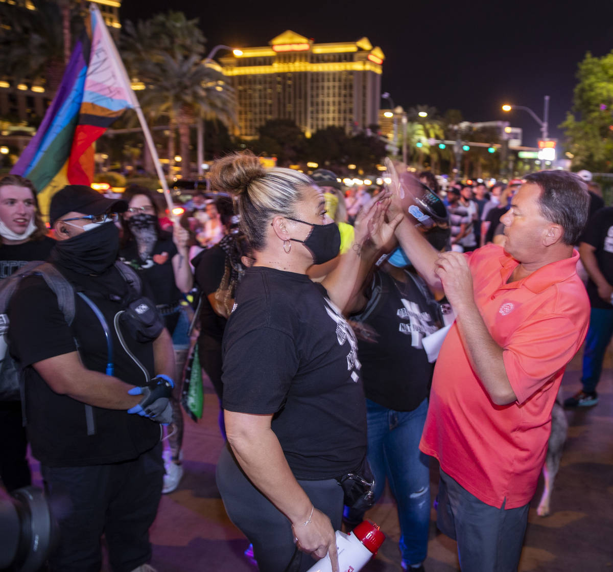 Organizer Leinati Hackley, left gets into a minor altercation with a visitor along the Strip du ...