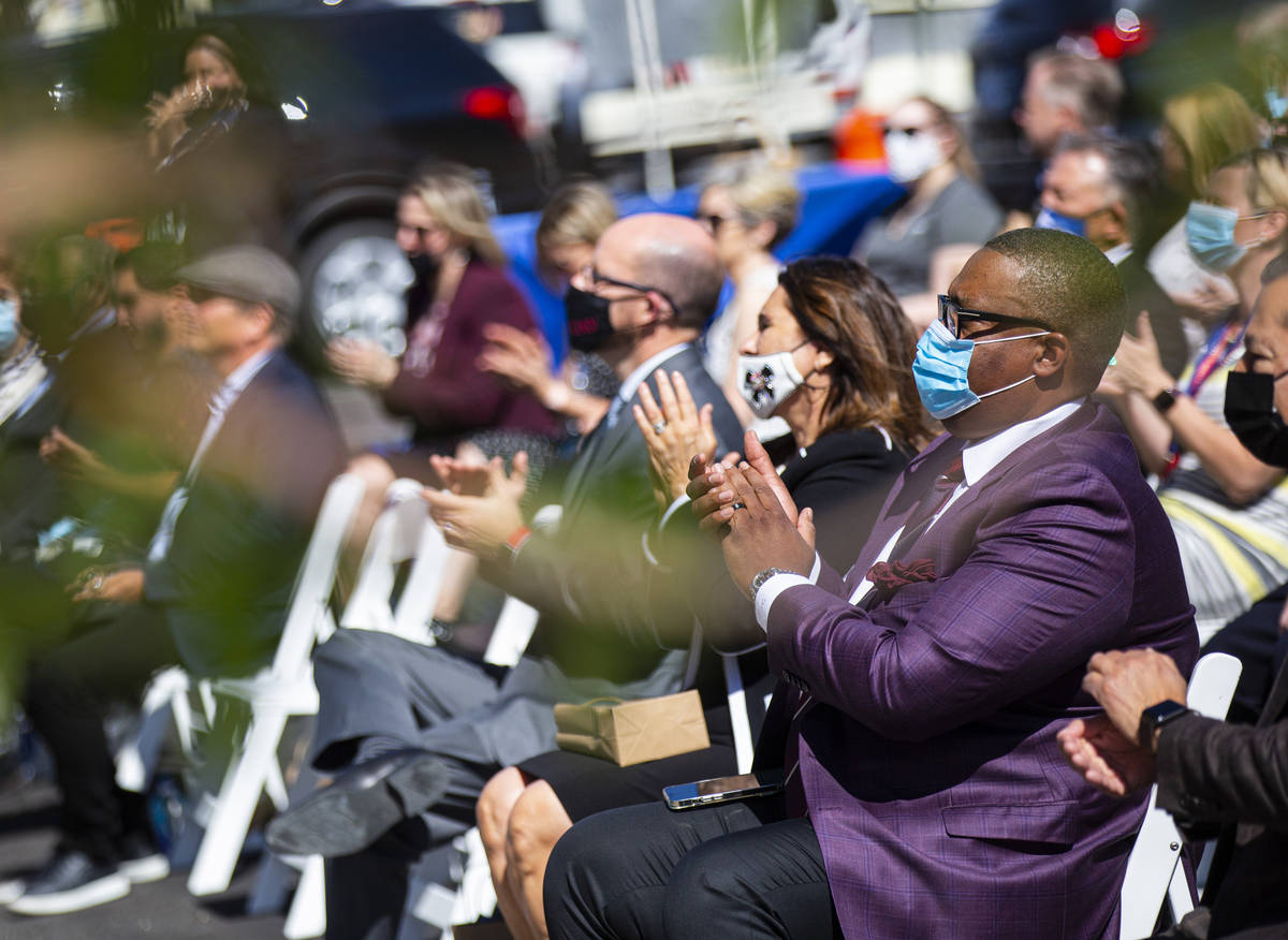 Las Vegas City Councilman Cedric Crear, right, claps during the opening ceremony for the $56 mi ...