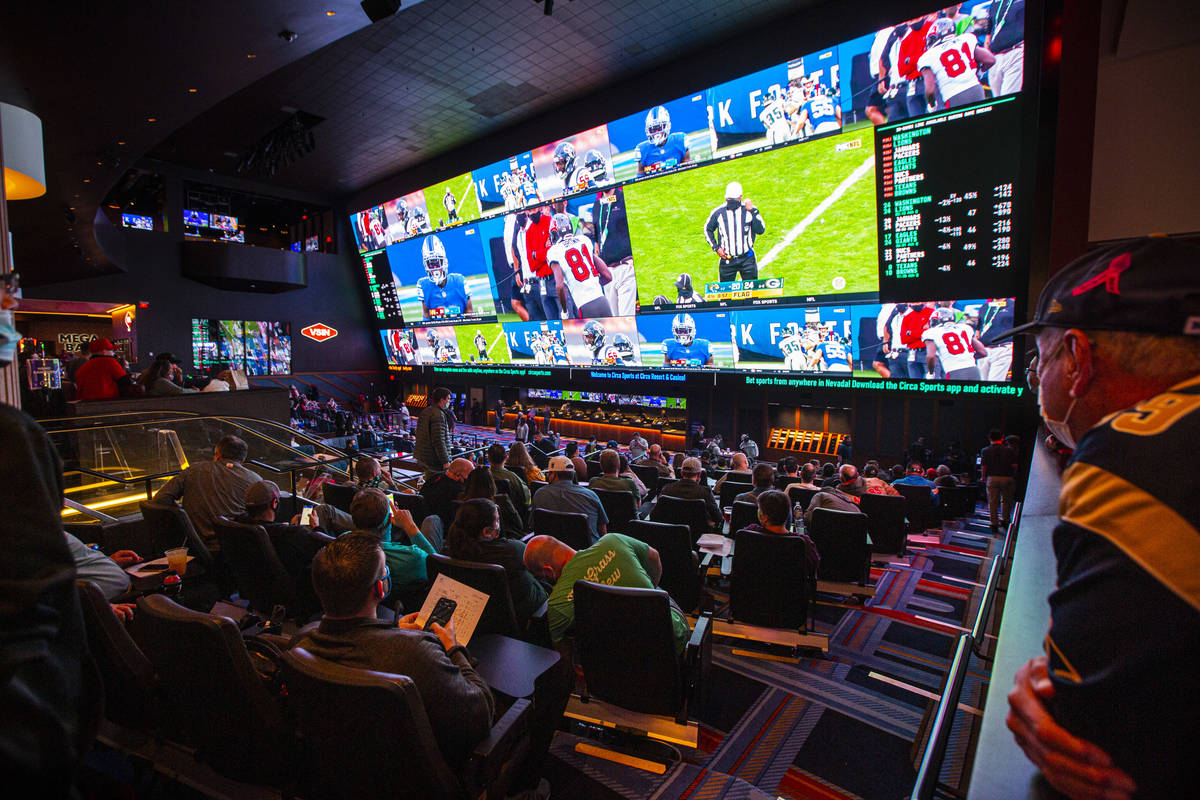 Football fans take in the action at the Circa Sportsbook as NFL games play across the 78-millio ...