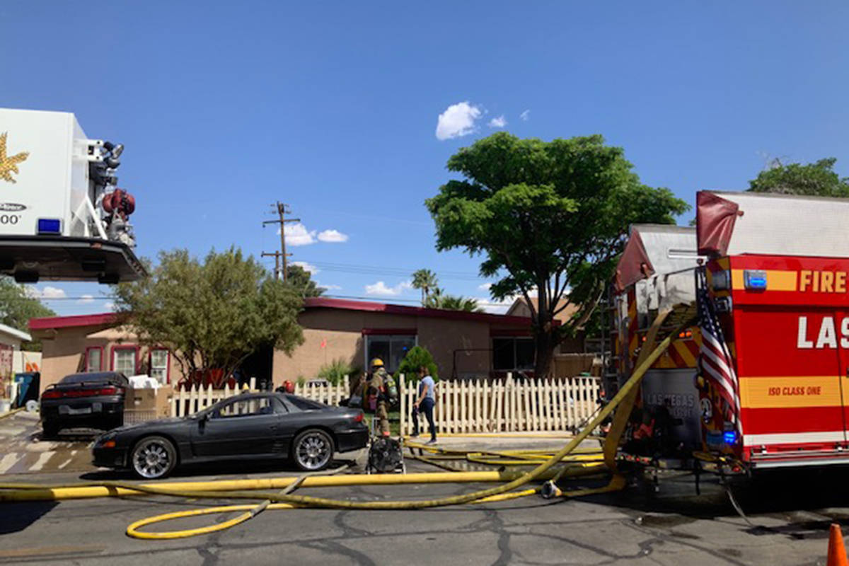 Crews battle a house fire Thursday, April 22, 2021, on the 2000 block of Las Verdes Street in L ...