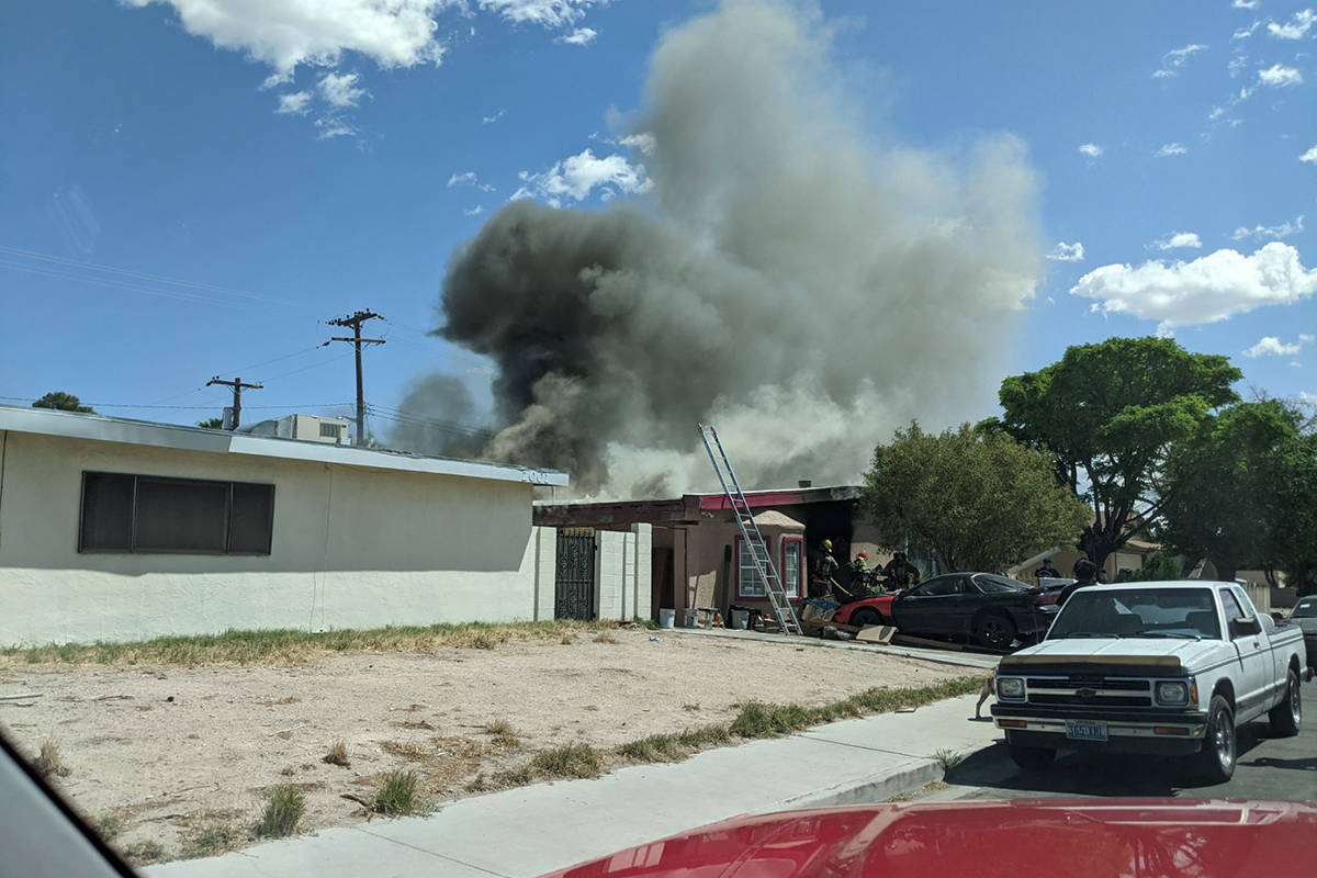 Crews battle a house fire Thursday, April 22, 2021, on the 2000 block of Las Verdes Street in L ...