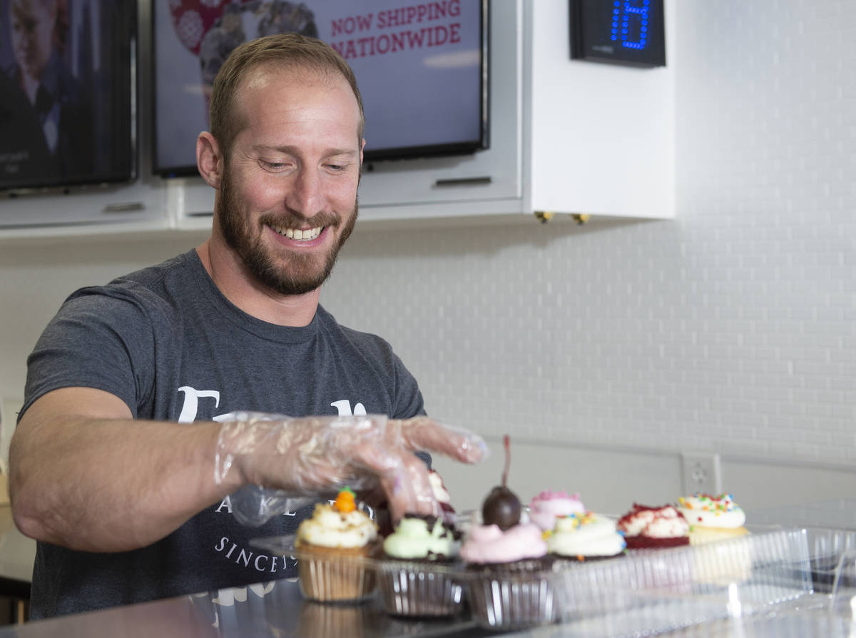 Max Jacobson-Fried, owner of Freed's Bakery, packs up some cupcakes at the Freed's dessert shop ...