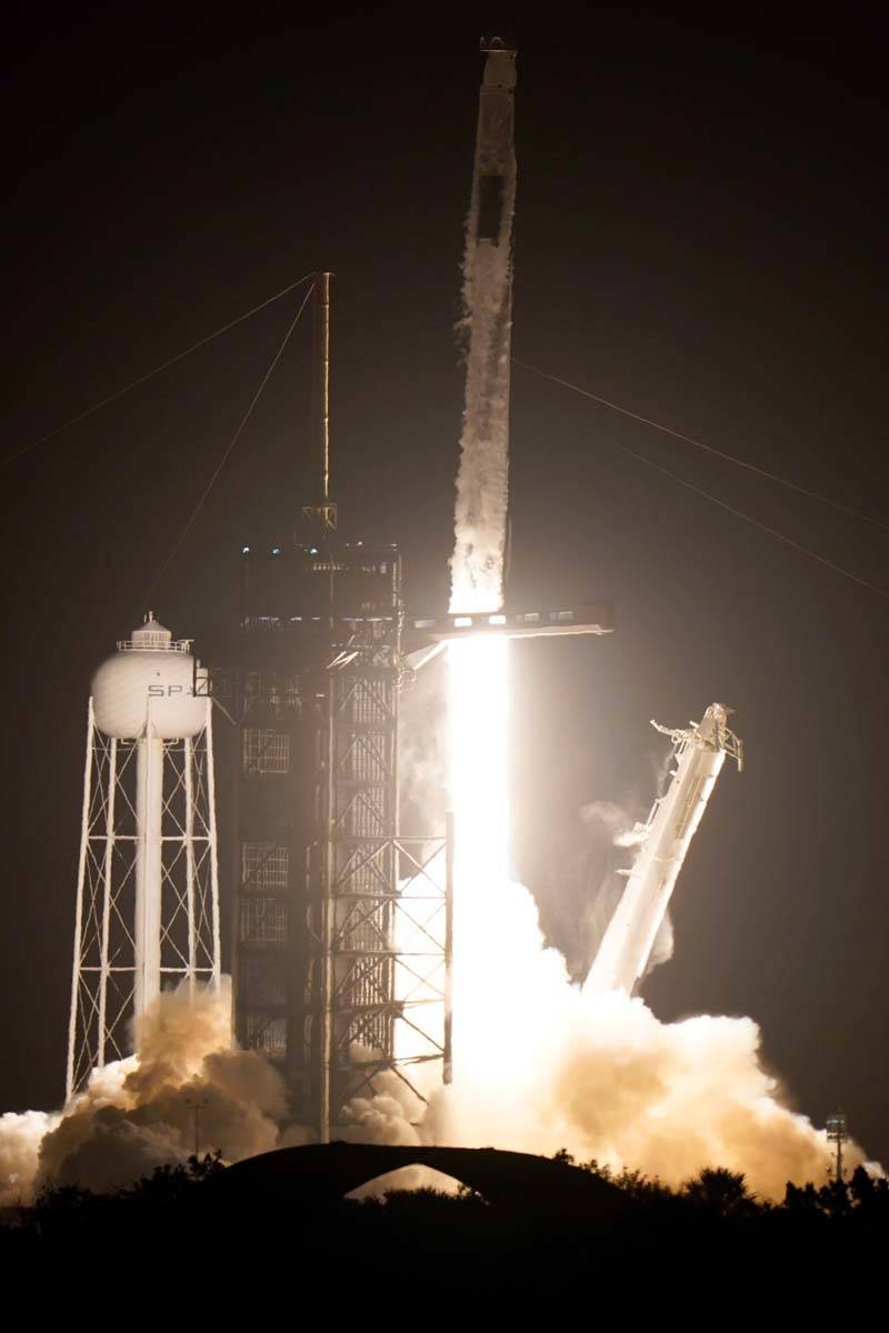 A SpaceX Falcon 9 rocket with the Crew Dragon space capsule lifts off from pad 39A at the Kenne ...