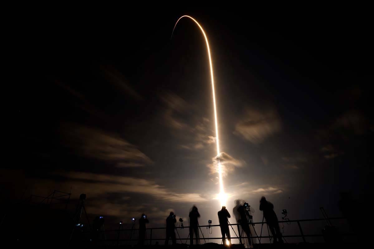 A SpaceX Falcon 9 lifts off in this time exposure from Launch Complex 39A Friday, April 23, 202 ...