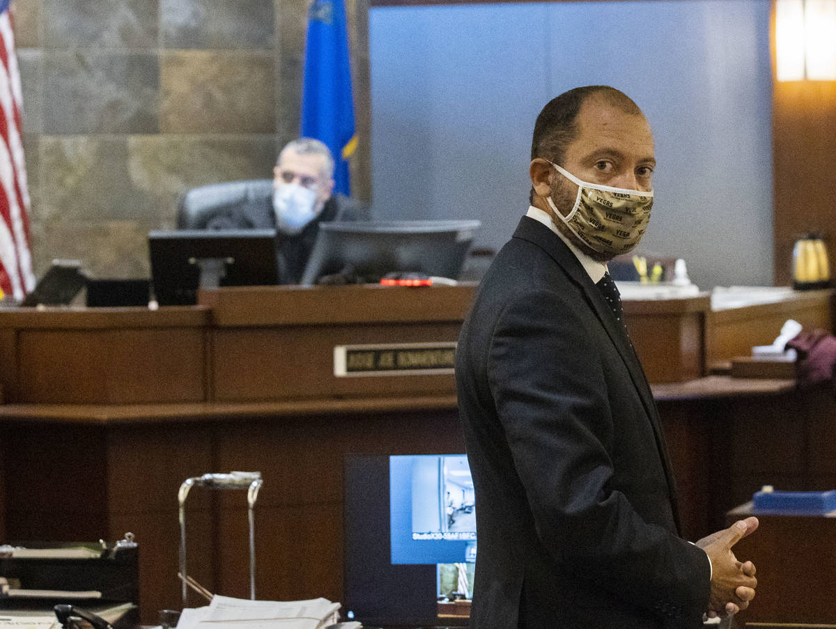 Prosecutor Christopher Hamner looks back as he addresses the court during a hearing for Aaron G ...