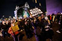 Protesters march in downtown Columbus, Ohio, Tuesday, April 20, 2021. Police shot and killed a ...