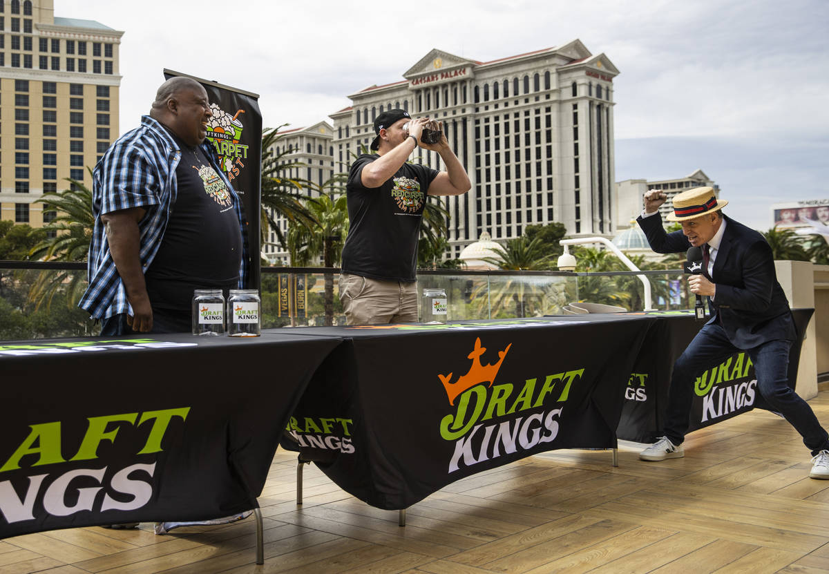 George Shea, right, declares Eric Badlands Booker, left, as the winner of the soda chugging con ...