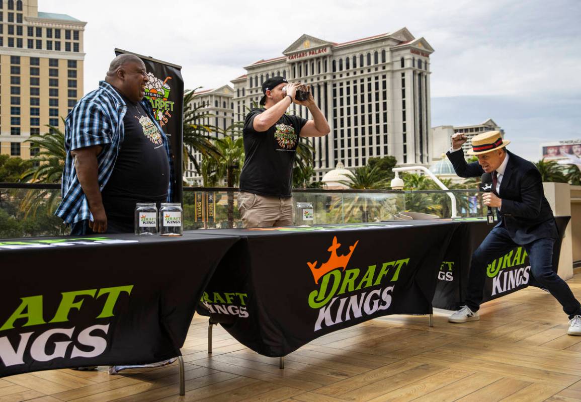 George Shea, right, declares Eric Badlands Booker, left, as the winner of the soda chugging con ...