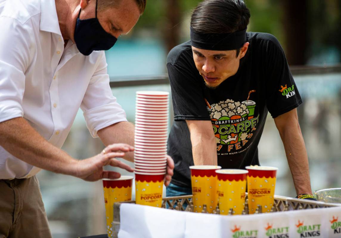 Matt Stonie looks on as his cups are tallied in the World Popcorn Eating Championship during th ...