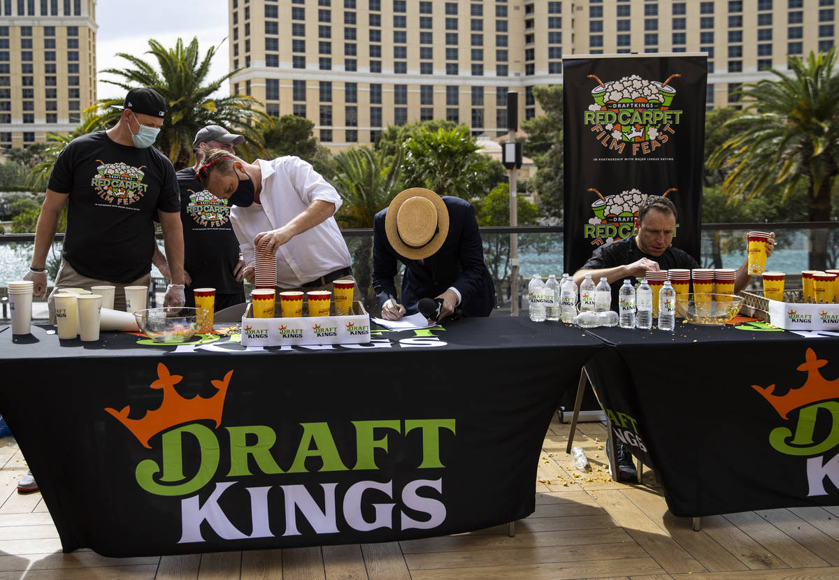 Cups are tallied in the World Popcorn Eating Championship during the "Red Carpet Film Feas ...