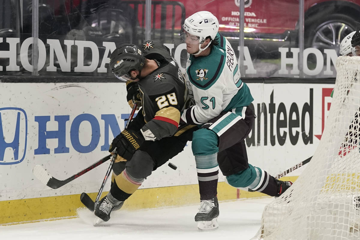 Anaheim Ducks' Haydn Fleury, right, defends against Vegas Golden Knights' William Carrier durin ...