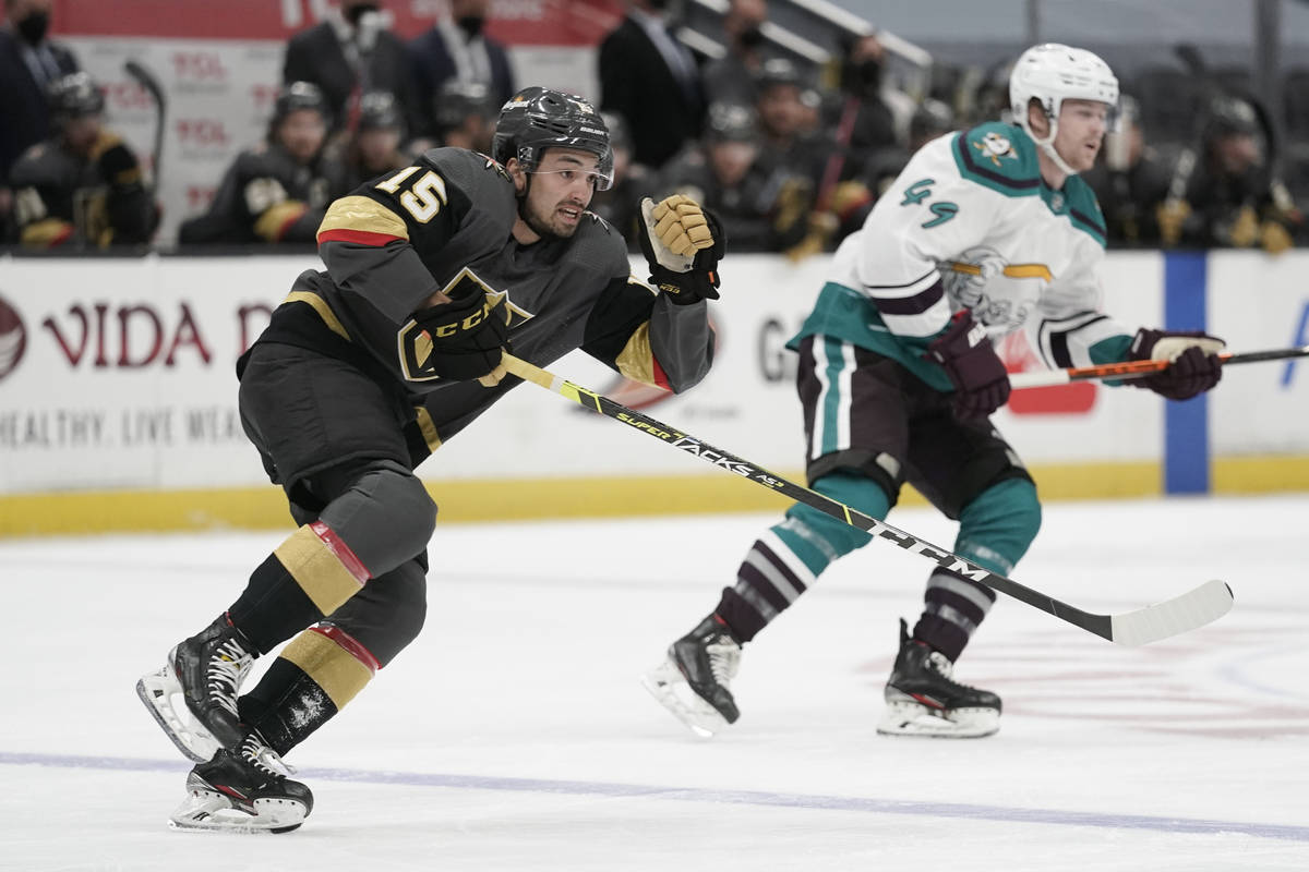 Vegas Golden Knights' Dylan Sikura, left, and Anaheim Ducks' Max Jones chase the puck during th ...