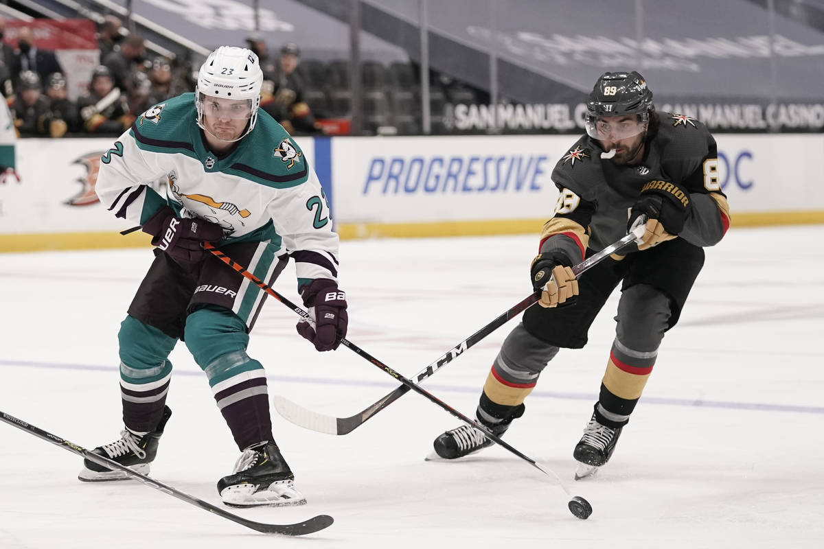 Vegas Golden Knights' Alex Tuch, right, takes the puck away from Anaheim Ducks' Sam Steel durin ...