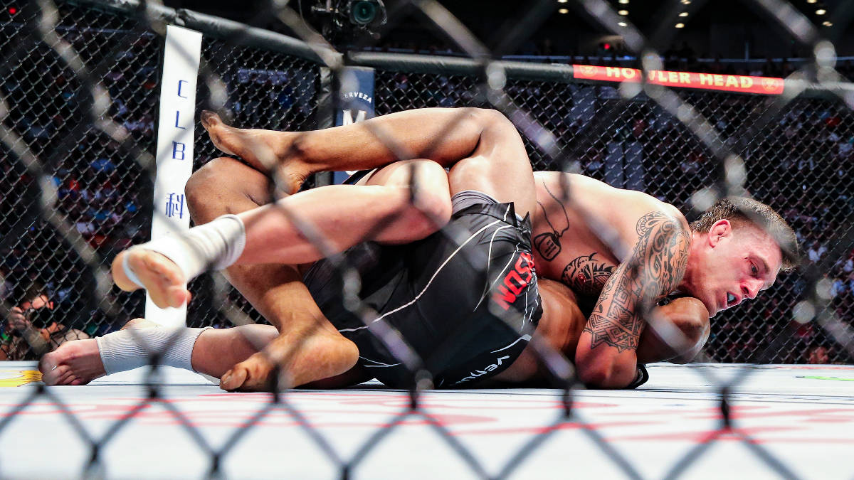 Brendan Allen, top, looks for a submission hold on Karl Roberson during a UFC 261 mixed martial ...