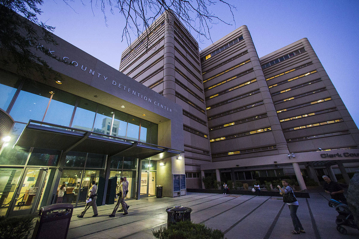 People walk outside of the Clark County Detention Center in downtown Las Vegas. (Chase Stevens/ ...