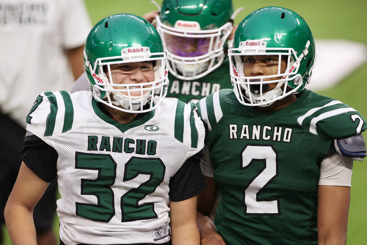 Rancho's Elijah Pittack (32) and Raymond Conner (2) talks to each other during a team practice ...