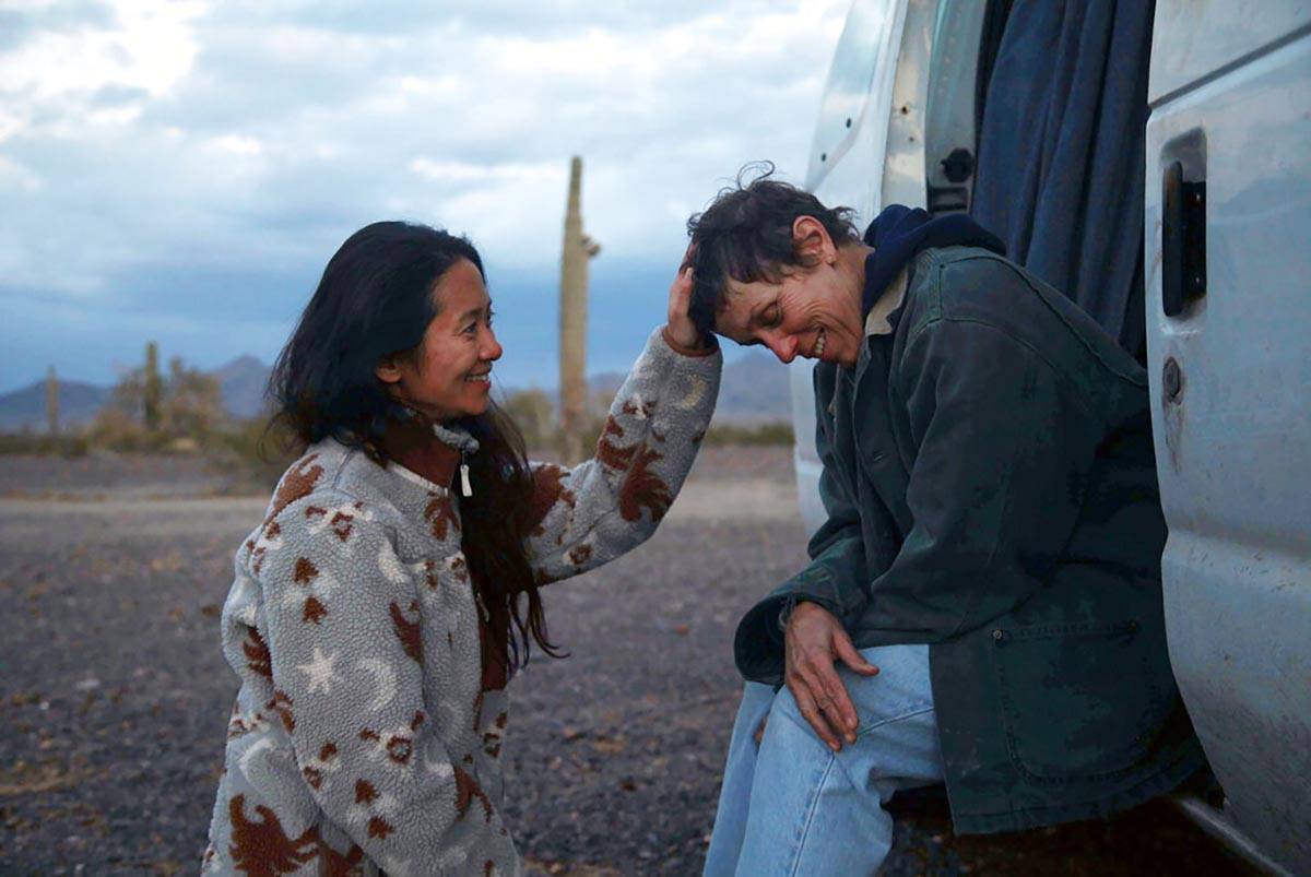 Director Chloe Zhao, left, appears with actress Frances McDormand on the set of "Nomadland ...