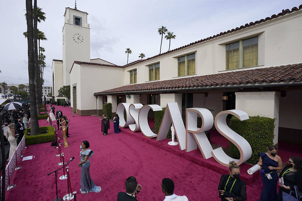 Maria Bakalova, from left, Andra Day and Regina King are interviewed and Marlee Matlin walks th ...