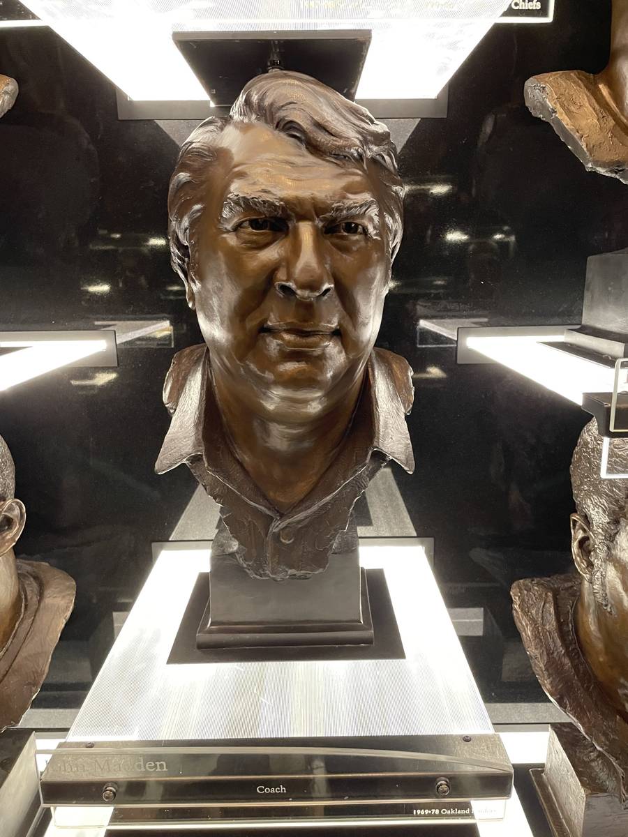 The bronze bust of former Raiders coach John Madden is displayed in the Pro Football Hall of Fa ...