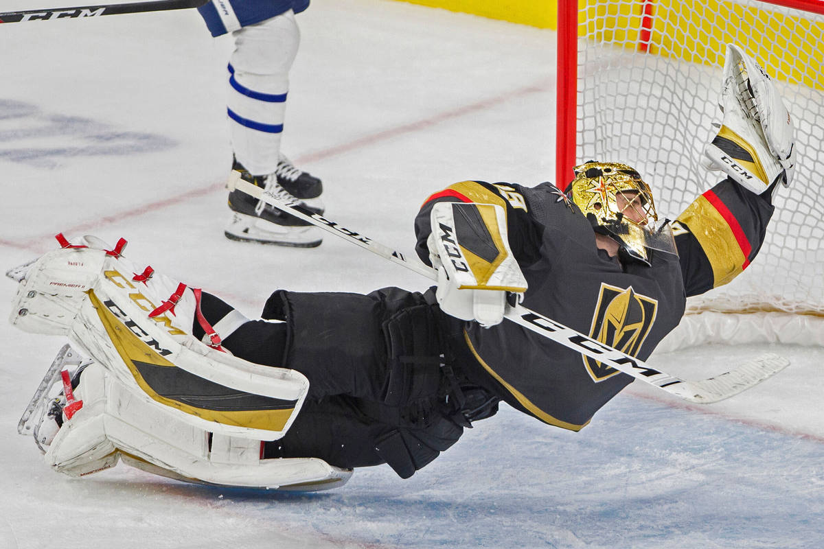 Vegas Golden Knights goaltender Marc-Andre Fleury (29) makes a diving save in the third period ...