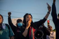 Mallory Thornton, of Durham, leads chants on a bullhorn while demonstrators marched peacefully ...