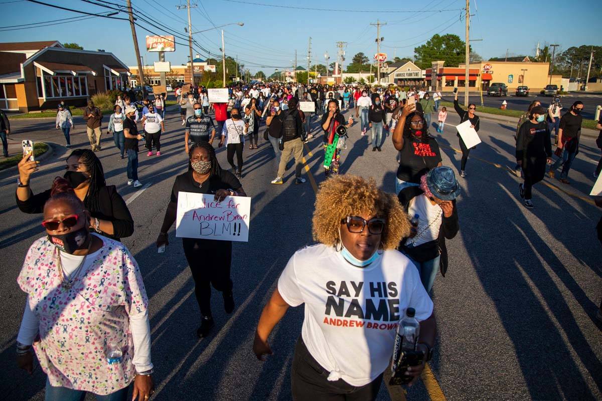 Demonstrators march peacefully in Elizabeth City, N.C., Monday April 26, 2021, after family vie ...