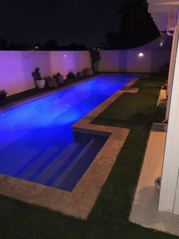 A nighttime view of the pool at 1764 Saint Thomas Drive, Henderson. (Alan Thibault)