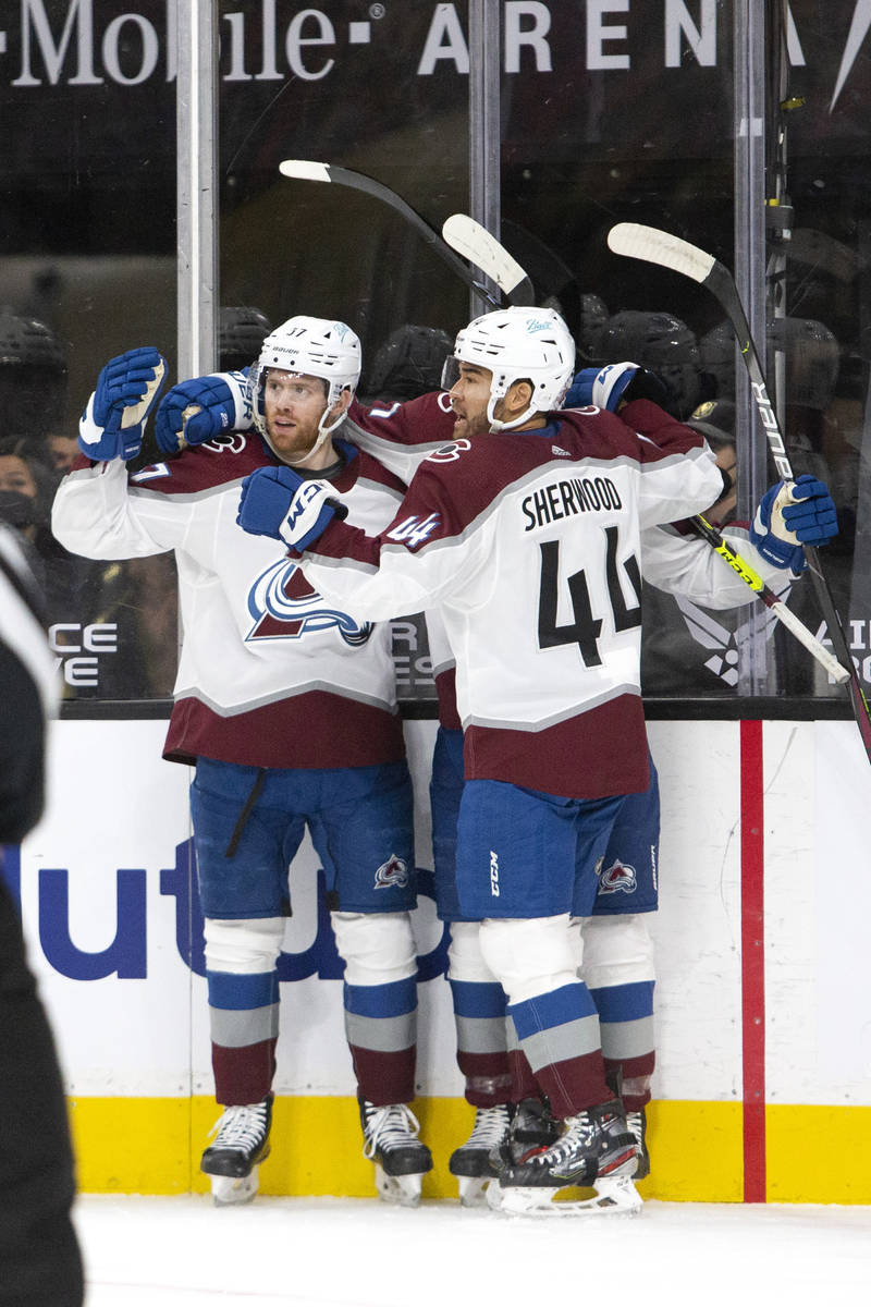 Avalanche left wing J.T. Compher (37) and Avalanche left wing Kiefer Sherwood (44) celebrate a ...