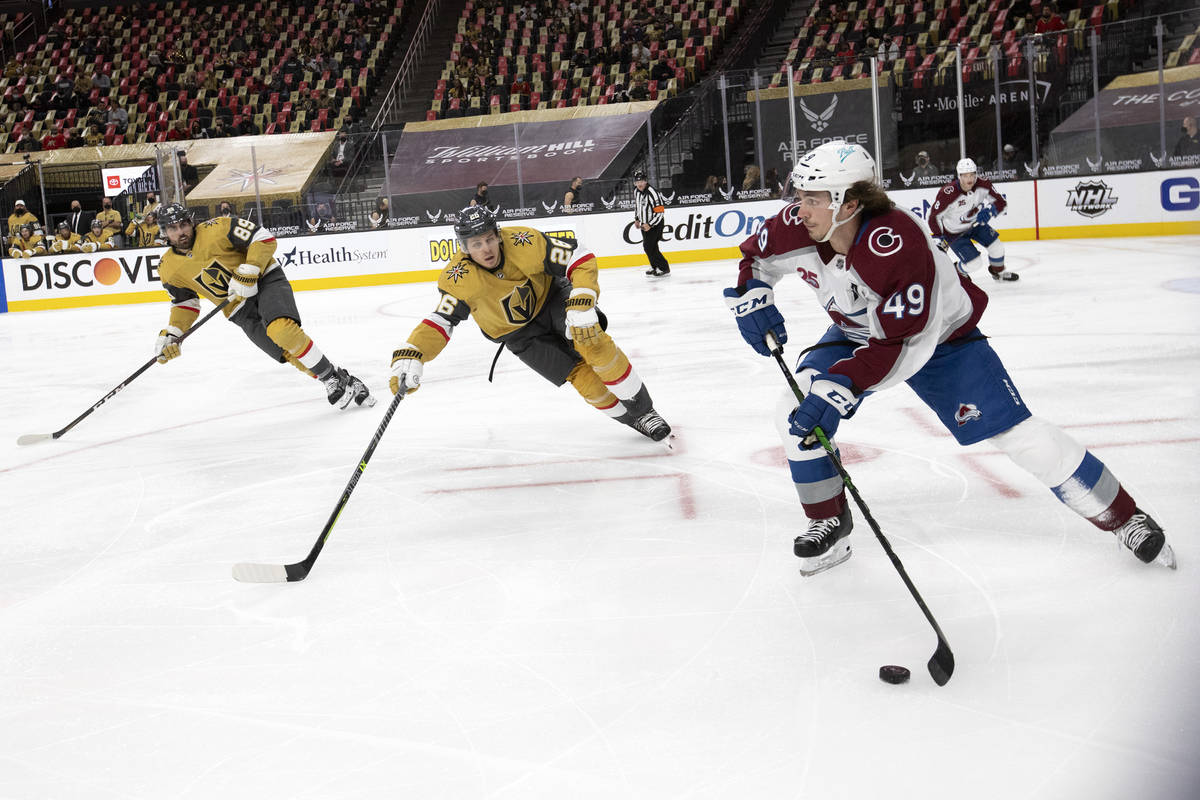 Avalanche defenseman Samuel Girard (49) looks to pass, followed by Golden Knights center Mattia ...