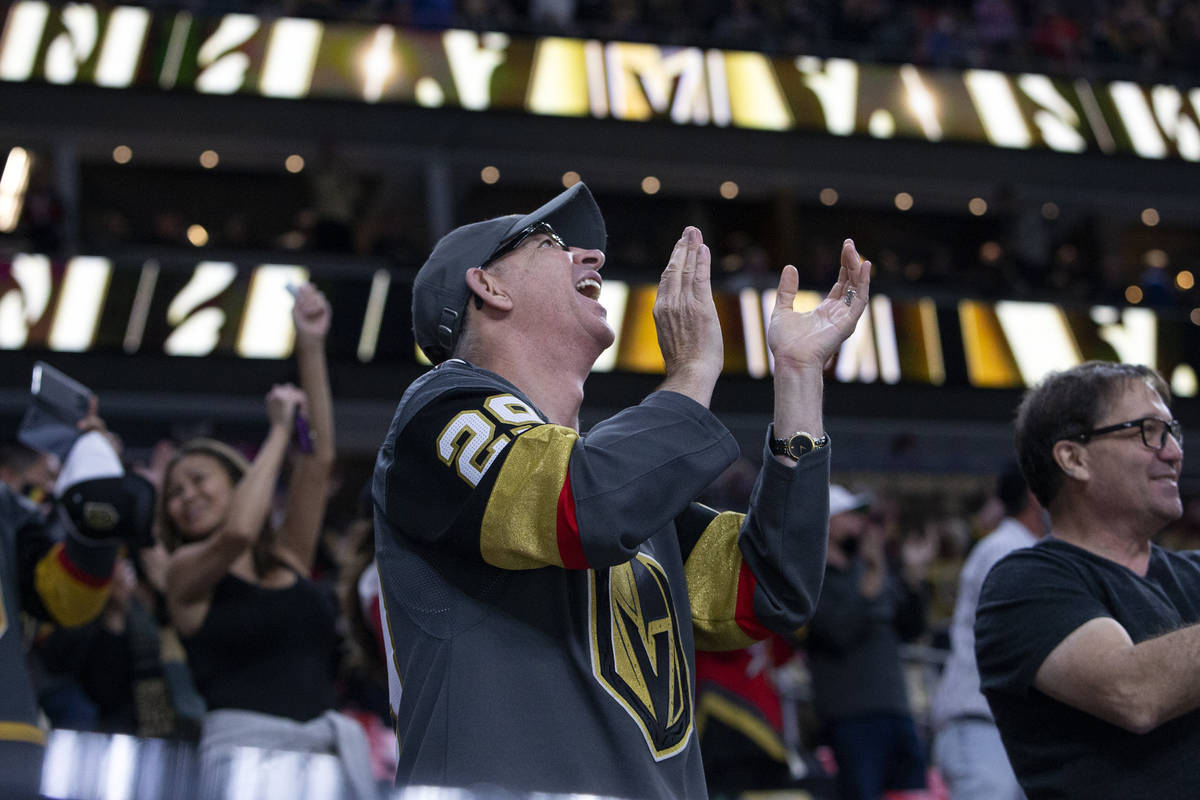 A Golden Knights fan celebrates a point scored for his team during the second period of an NHL ...