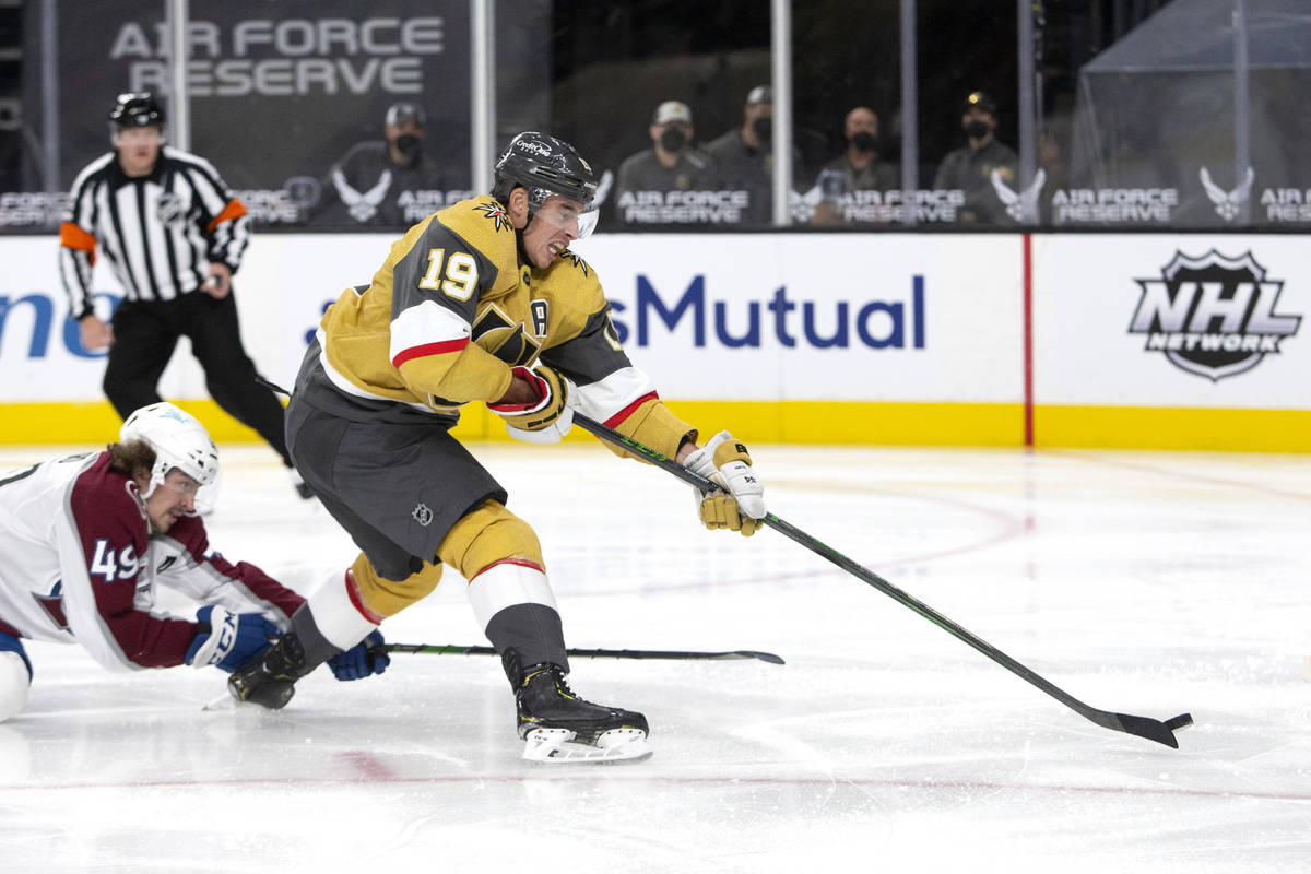 Golden Knights right wing Reilly Smith (19) makes an unsuccessful shot on goal while Avalanche ...