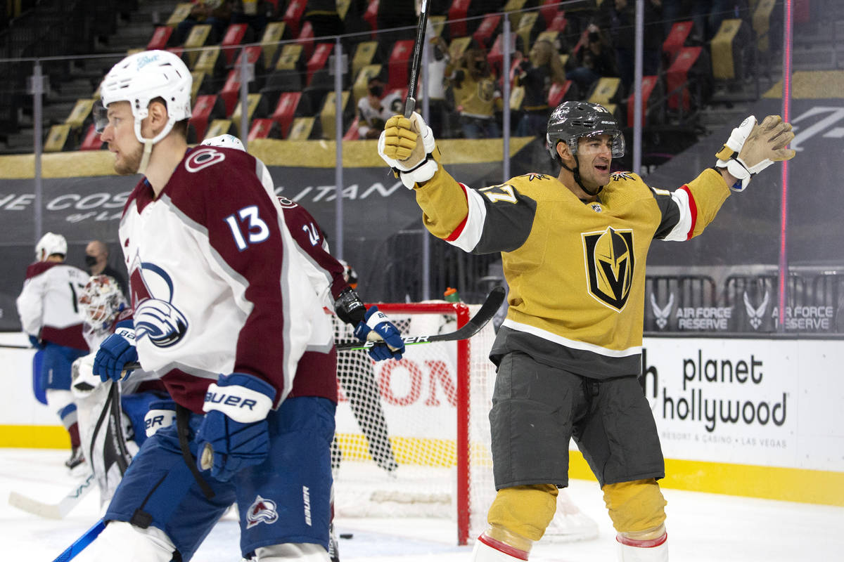 Golden Knights left wing Max Pacioretty (67) celebrates a goal scored by right wing Mark Stone ...