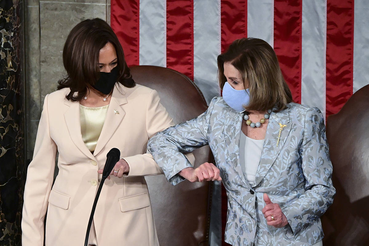 Vice President Kamala Harris, left, greets House Speaker Nancy Pelosi of Calif., ahead of Presi ...