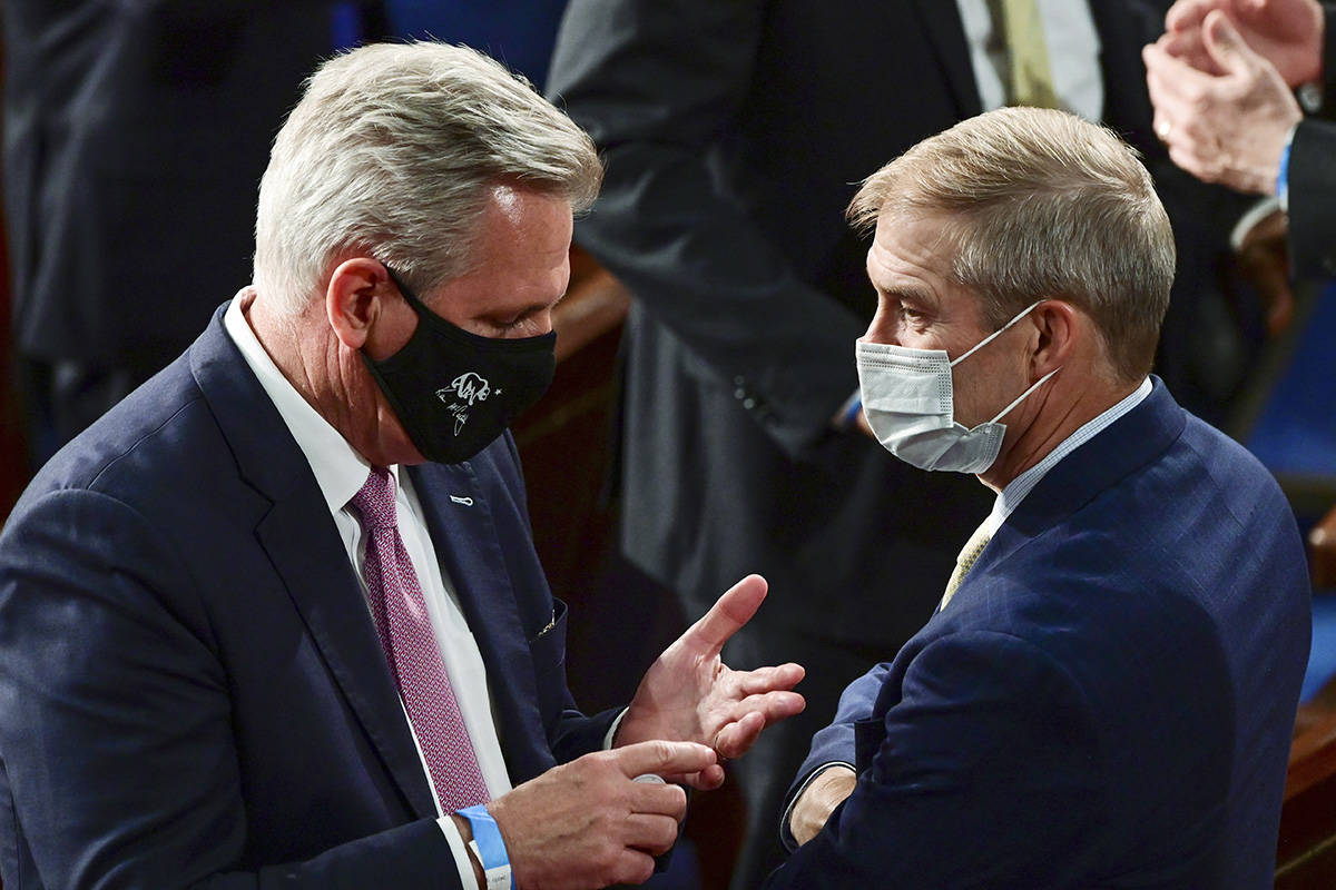 House Minority Leader Kevin McCarthy of Calif., left, speaks with Rep. Jim Jordan, R-Ohio, bef ...