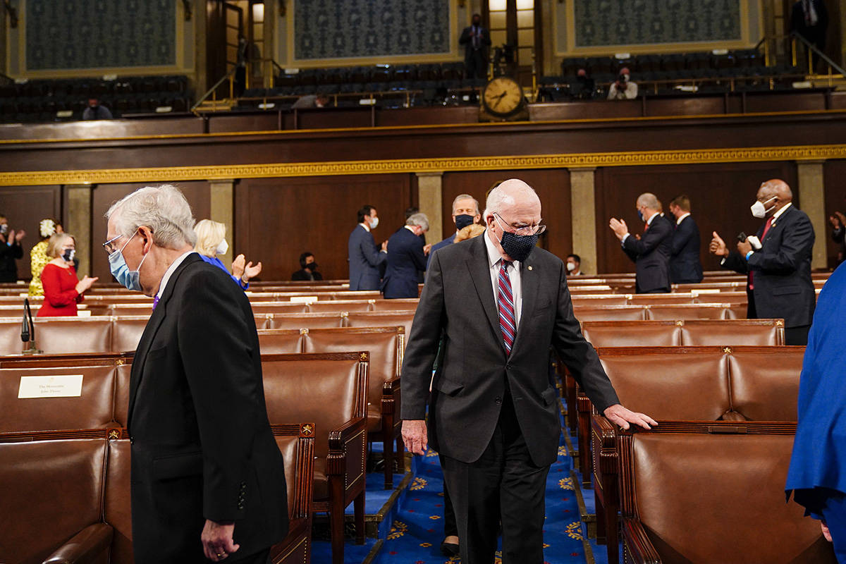 Sen. Patrick J. Leahy, D-Vt., center, and Senate Minority Leader Mitch McConnell, R-Ky., left, ...