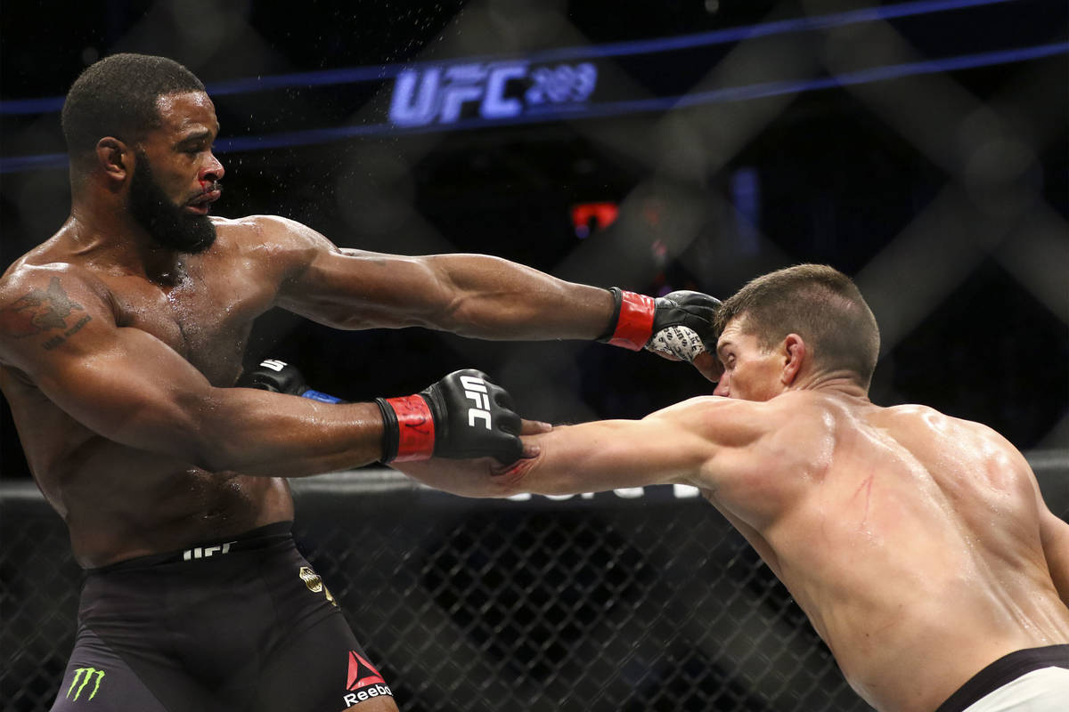 Tyron Woodley of the United States, left, fights Stephen Thompson of the United States during t ...