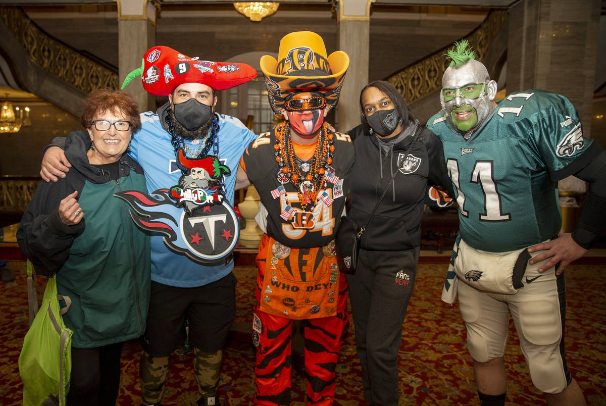 Denean Vaughn, who was selected as the Raiders Fan of the Year, meets with fans, from left, Mar ...